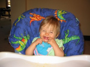 Cheesy grin (the bib says "cutie pie" in case you were wondering)